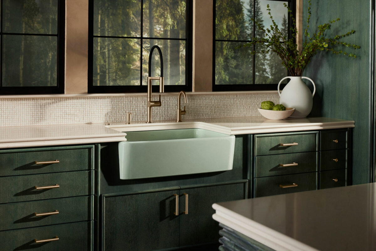 A close-up of the Ironridge™ farmhouse sink in Spring Green showcases its glossy enamel finish and generous depth.