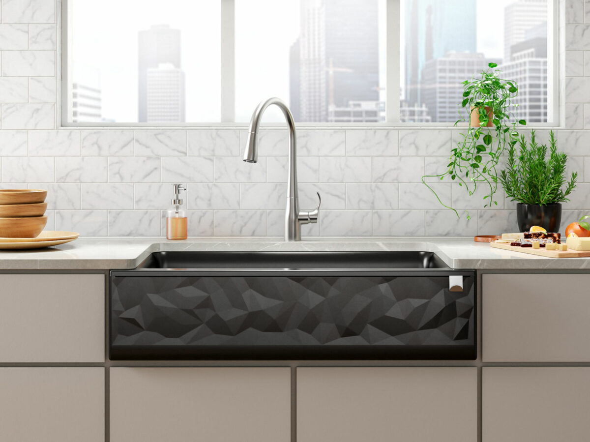  KOHLER Neoroc® sink in Matte Black with a unique faceted apron front brings architectural detail to a modern kitchen.