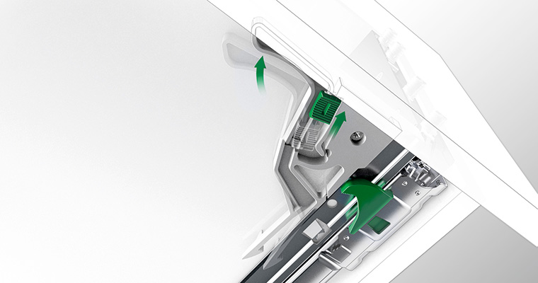 Technical illustration of the GRASS child safety hardware beneath a drawer, with arrows highlighting the release mechanism.