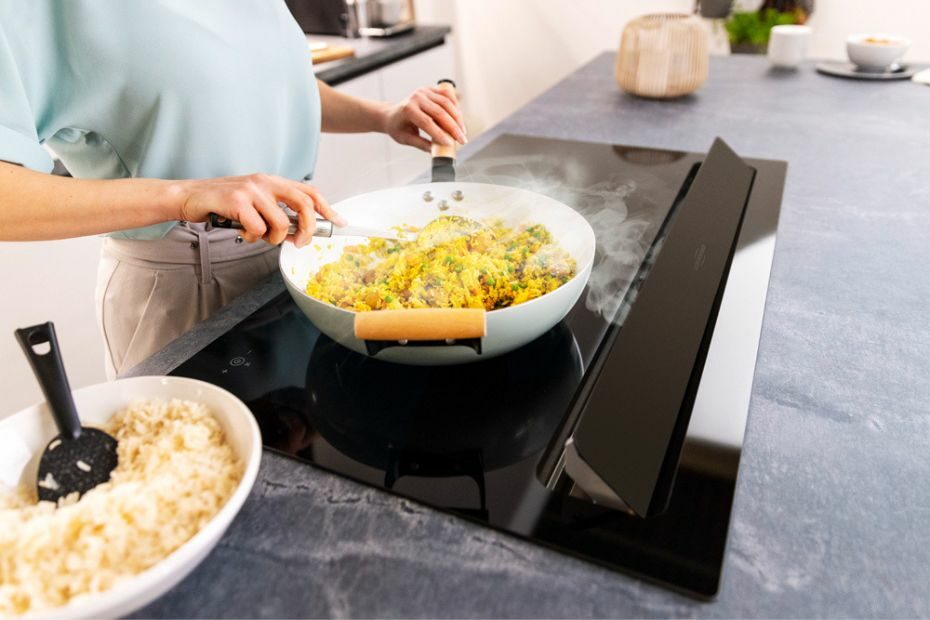 Kitchen cabinet with full-depth drawers installed beneath an ORANIER hob with integrated cooktop extractor.