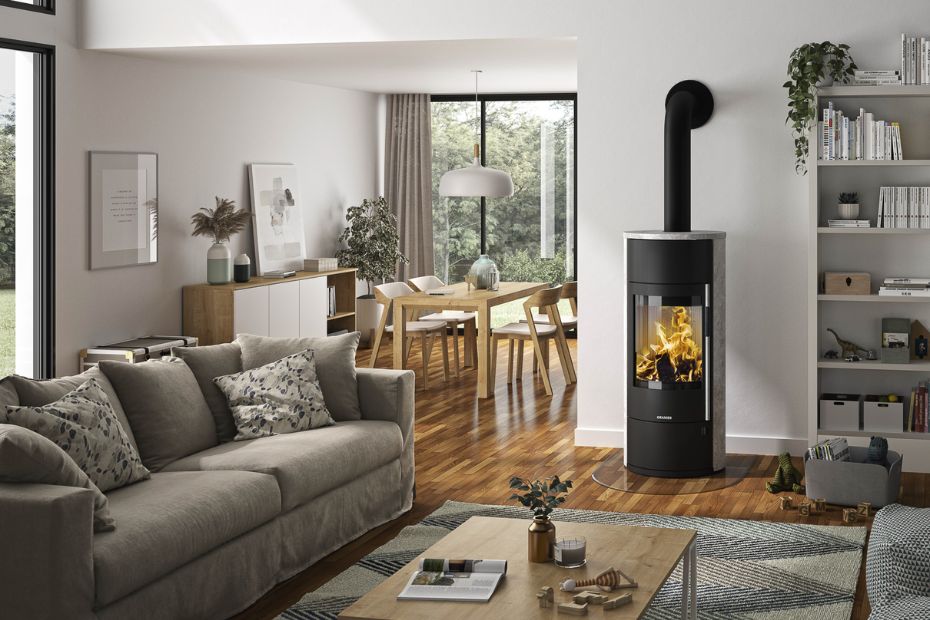 Kitchen with Seating and Dining Area; in the Foreground: ORANIER Club UH-550 Fireplace with Sintered Stone Cladding and Large Viewing Window.