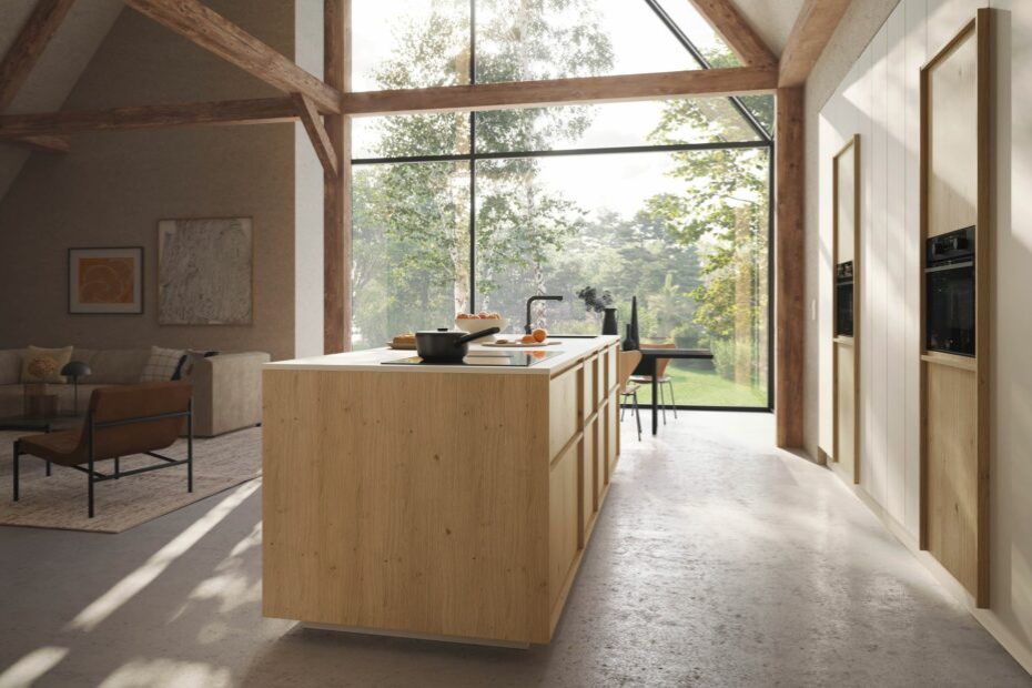 Modern Rotpunkt kitchen with a natural wood island, tall glazing and open living area.